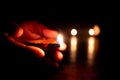 Person holding diya with hands during the Indian festivals. Karthigai deepam festival of lights celebrated in south india