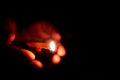 Person holding diya with hands during the Indian festivals. Karthigai deepam festival of lights celebrated in south india