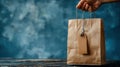 Generative AI Hand Holding Shopping Paper Bag with Empty Tag on a Dark Wooden Surface business concept. Royalty Free Stock Photo