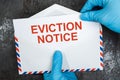 Person Holding Eviction Notice In Envelope Royalty Free Stock Photo