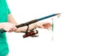 Person holding fishing rod, spinning equipment