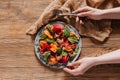 person holding fork and plate with salad with mussels, vegetables Royalty Free Stock Photo