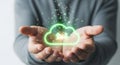 Person holding glowing cloud icon symbolizing digital data storage and technology innovation Royalty Free Stock Photo