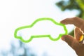 Person holding green eco car Royalty Free Stock Photo