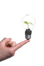 Person holding a green light bulb Royalty Free Stock Photo