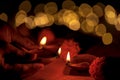 Person Holding and Illuminating Diwali Diya Royalty Free Stock Photo