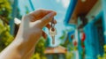 A person holding a key to a house Royalty Free Stock Photo