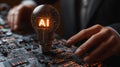 A person is holding a light bulb with the letters AI on it. Concept of innovation and technological advancement Royalty Free Stock Photo
