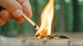A person holding a match to the end of an unlit stick, AI Royalty Free Stock Photo
