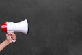 Person holding a megaphone or loud hailer Royalty Free Stock Photo