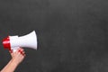 Person holding a megaphone or loud hailer Royalty Free Stock Photo