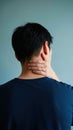Person Holding Neck Back View Experiencing Pain or Soreness Tension