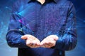 A person holding out hands with digital graphics of data and connectivity hovering above, on a blue technological background, Royalty Free Stock Photo