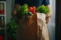 A person holding a paper bag