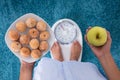 Person Holding Plate Of Cookies And Apple Royalty Free Stock Photo