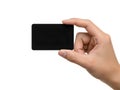 A person holding a small black rectangular object in their hand Royalty Free Stock Photo