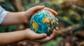 Person Holding Small Globe in Hands