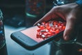 Person Holding Smartphone Over Pill Pile