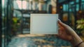 A person holding a square white piece of paper in their hand, AI Royalty Free Stock Photo