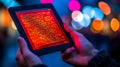 Person holding a tablet displaying digital code on screen Royalty Free Stock Photo