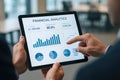 Person holding tablet displaying financial analytics with charts and graphs digital Royalty Free Stock Photo