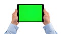 Person holding tablet displaying solid green chroma key screen for video editing demonstration Royalty Free Stock Photo