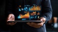 Person holding tablet with innovative data visualization graphics displayed