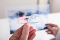 Person Holding Transparent Aligner