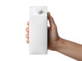 A person holding a white rectangular portable charger or device against a plain background Royalty Free Stock Photo