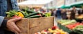 The Person Holding a Wooden Basket of Fresh Vegetables at a Market. AI generated image Royalty Free Stock Photo