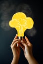 Person holding a yellow light bulb with cloud sketches AI generated