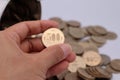 A person holding a 500 yen coin Royalty Free Stock Photo