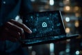 Futuristic Digital Lock Icon displayed on a Folding Tablet Screen with Glowing Circuits and Data Streams Royalty Free Stock Photo