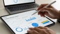 Person using stylus on tablet displaying customer behavior analytics and business charts Royalty Free Stock Photo