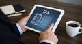 A person holds a tablet displaying a digital checklist with the word \