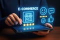 Person holding tablet with e-commerce interface, store icon, and customer feedback icons online shopping Royalty Free Stock Photo