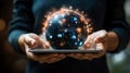 A person holds a tablet with a glowing orb displaying digital icons and light effects Royalty Free Stock Photo