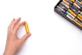 Person holds Used alkaline batteries AA size format.