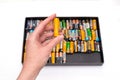 Person holds Used alkaline batteries AA size format.