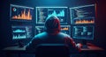 Anonymous hacker wearing hoodie working on multiple computer screens with data charts and programming code Royalty Free Stock Photo