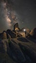 A person illuminating Boot Arch in Alabama Hills under the Milky Way Galaxy Royalty Free Stock Photo