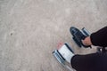 Person injured in a wheelchair. Foot and hand bandages, outdoor photography in a park