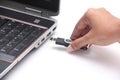 Person inserting a usb drive into a laptop Royalty Free Stock Photo