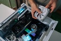 Person installing new pc cooling fan into modern desktop gaming computer case, performing hardware assembly and Royalty Free Stock Photo