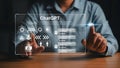 Person interacting with Chat G P T interface displaying A I icons and chat bubbles artificial Royalty Free Stock Photo
