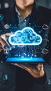 Person interacting with a digital cloud interface on a tablet showing data connections and icons Royalty Free Stock Photo