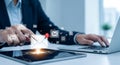 Person interacting with digital email icons on tablet and laptop communication technology Royalty Free Stock Photo