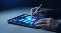 Person Interacting with Digital Tablet and Stylus in a Dark Environment Royalty Free Stock Photo