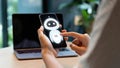Person interacting with friendly ai chatbot on smartphone screen Royalty Free Stock Photo