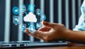 Person interacting with futuristic cloud interface surrounded by digital icons. Royalty Free Stock Photo